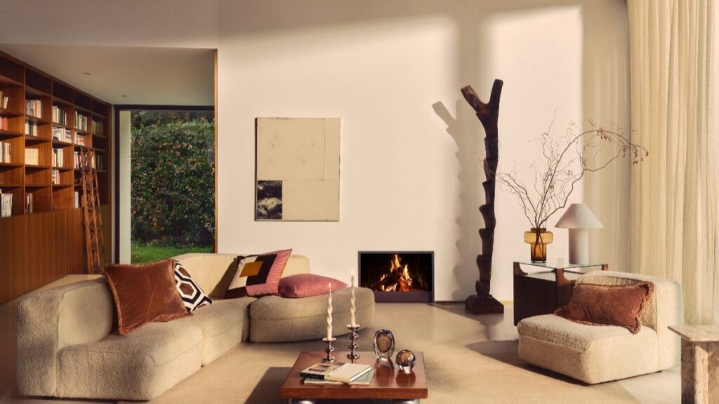Curved sofa with velvet fabric and layered cushions